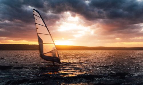 windsurfing-on-a-lake-at-sunset-2023-11-27-04-49-10-utc-1